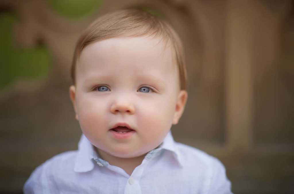 Westchester lifestyle child headshot Lifestyle photo of a toddler boy taken at a park in Connecticut