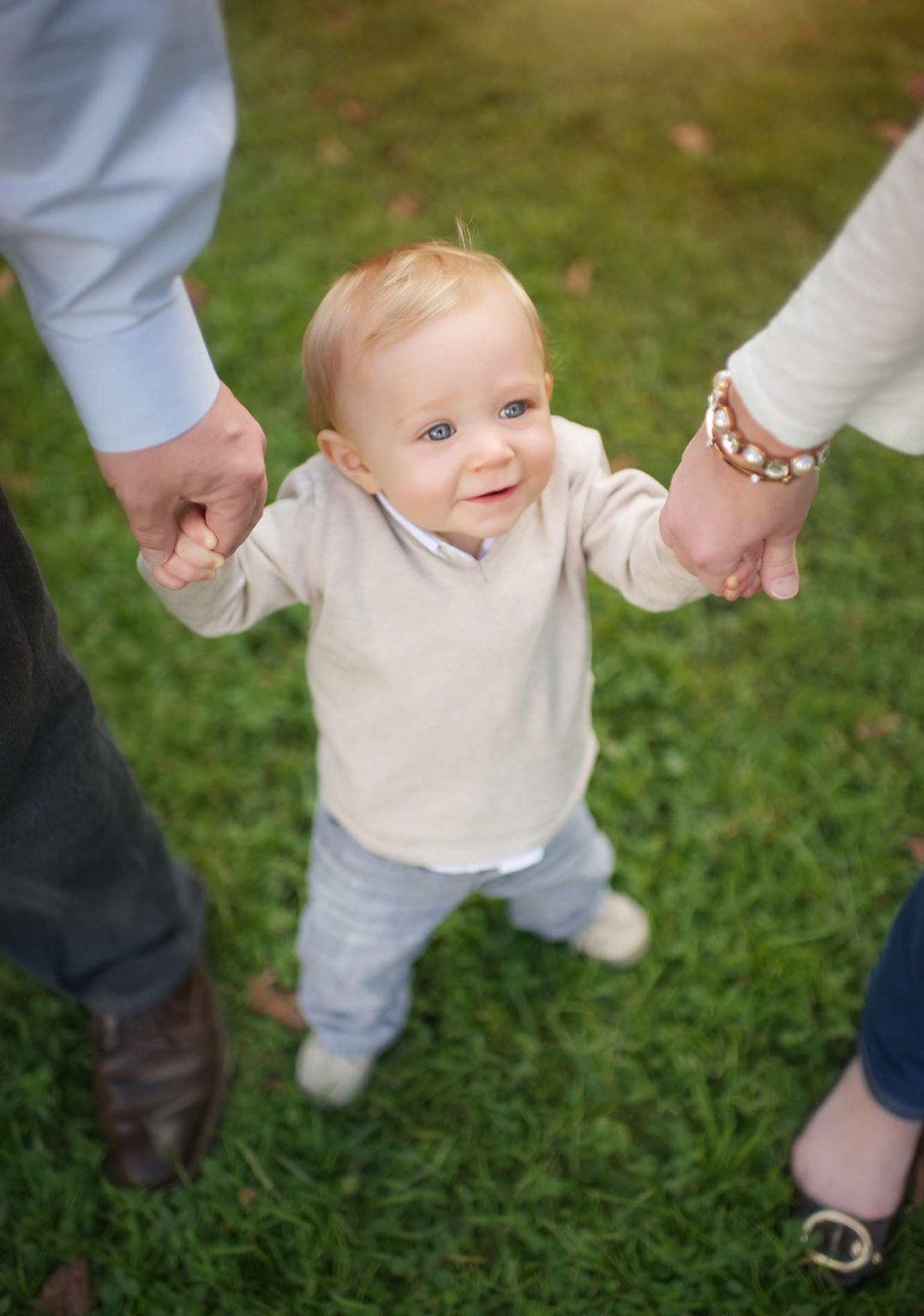 Adorable baby standing in grass
