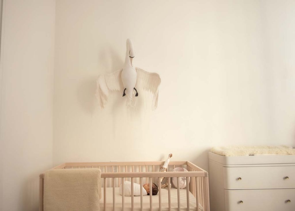 Photo of a beautifully decorated nursery with a baby sleeping in the crib at this modern apartment in Scarsdale, NY.