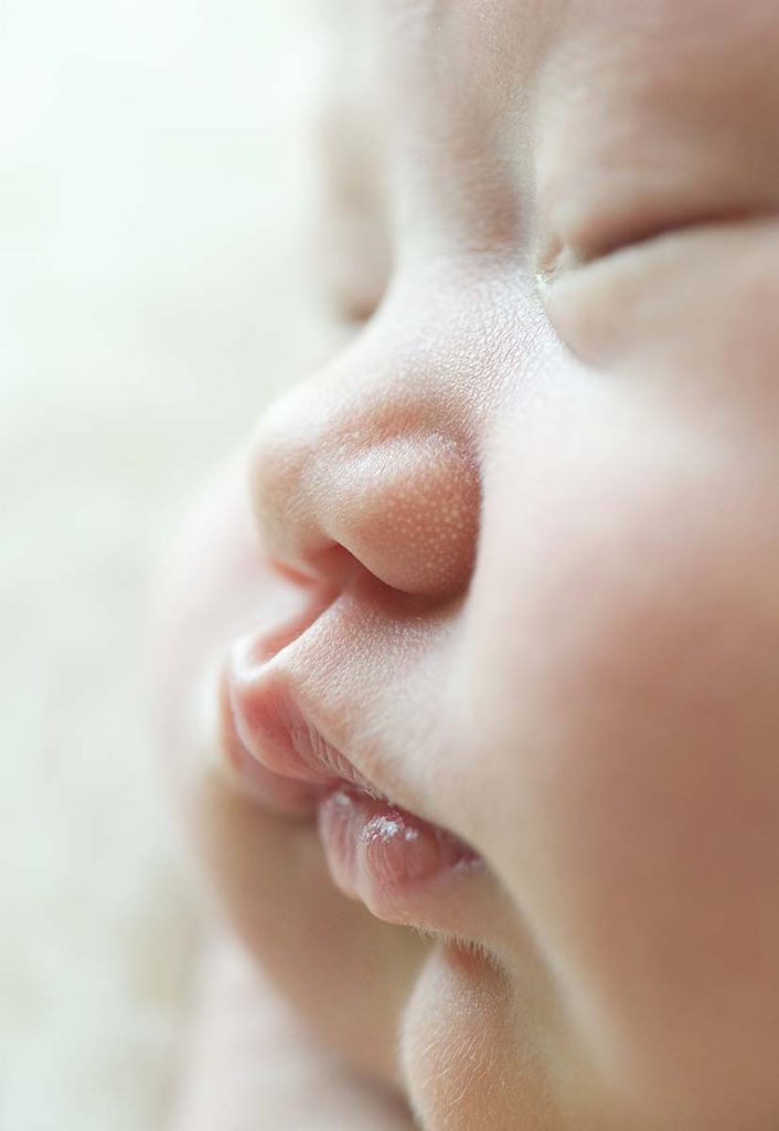 Close up of a newborn baby's nose and lips