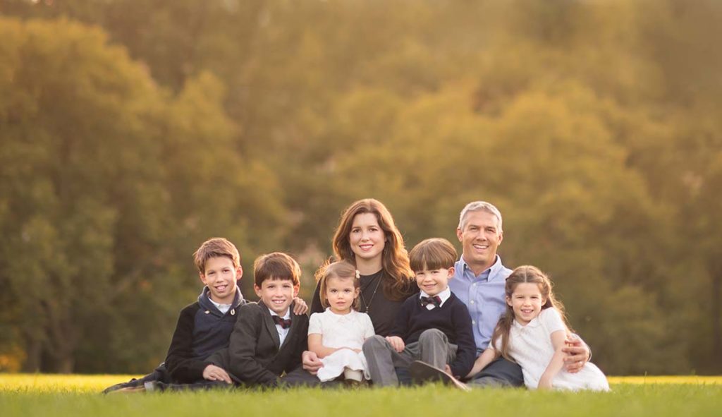 big family outdoor photo A family with five children sitting in grass and posing for this timeless family photograph taken in western Connecticut