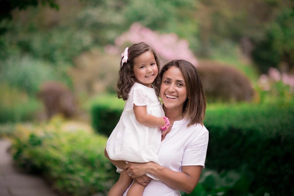 botanical gardens mother holding daughter Mother holding her baby girl as captured in this photo by a child photographer