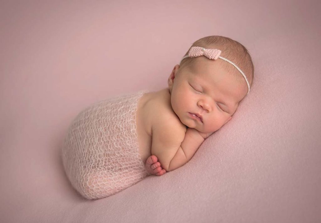 A newborn baby from Connecticut posing for a photo