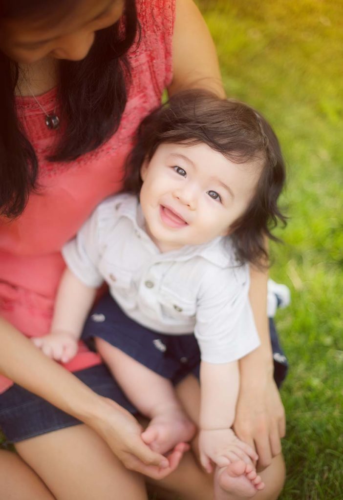 cute baby looking up Beautiful baby looking up at the photographer