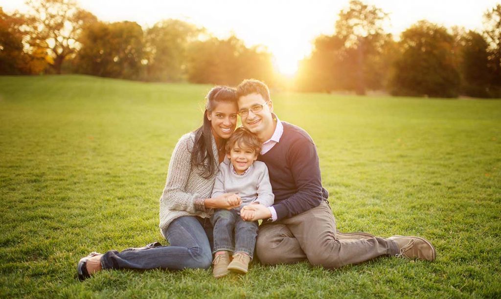 Greenwich lawn family photo shoot Beautiful family from Greenwich CT posing for a family photo during sunset