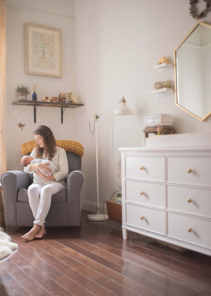 Connecticut Farmhouse remodeled into a beautiful nursery is the setting for this timeless newborn photo between a mother and her infant baby.