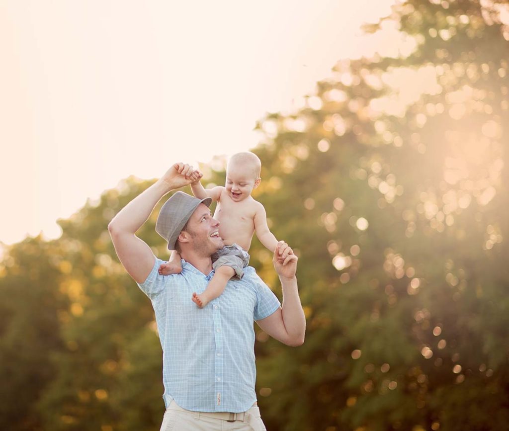 father fedora baby shoulders Timeless baby photo of a father and his son