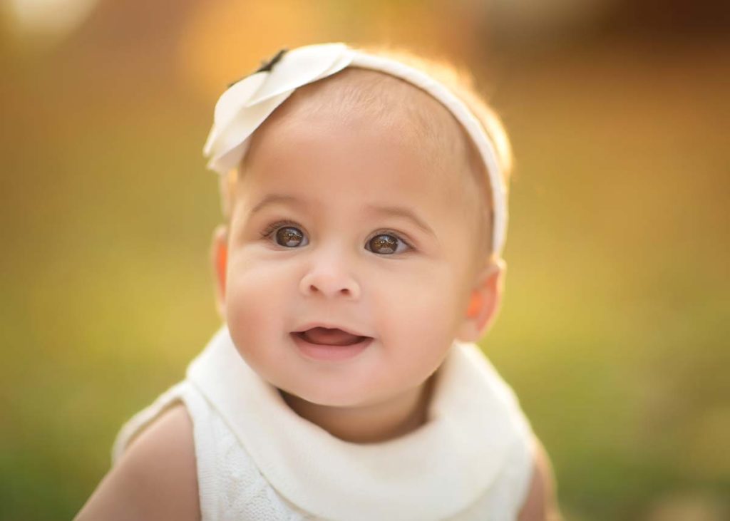 glowing sunshine baby headband Sunset photo of a little girl with a headband