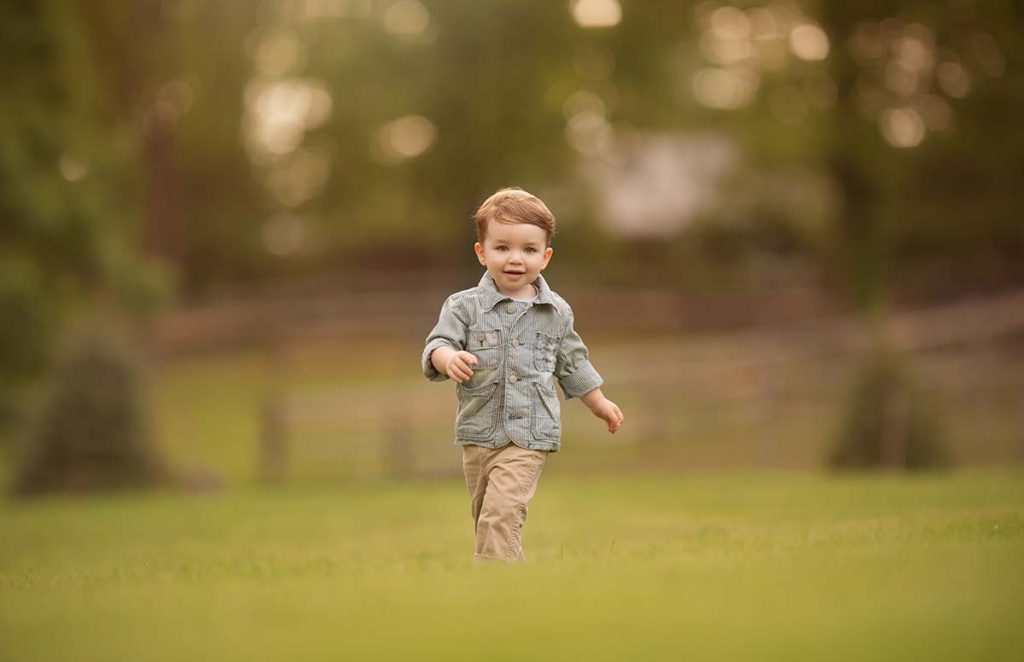 horse farm boy running Boy on a Westchester county farm running happy