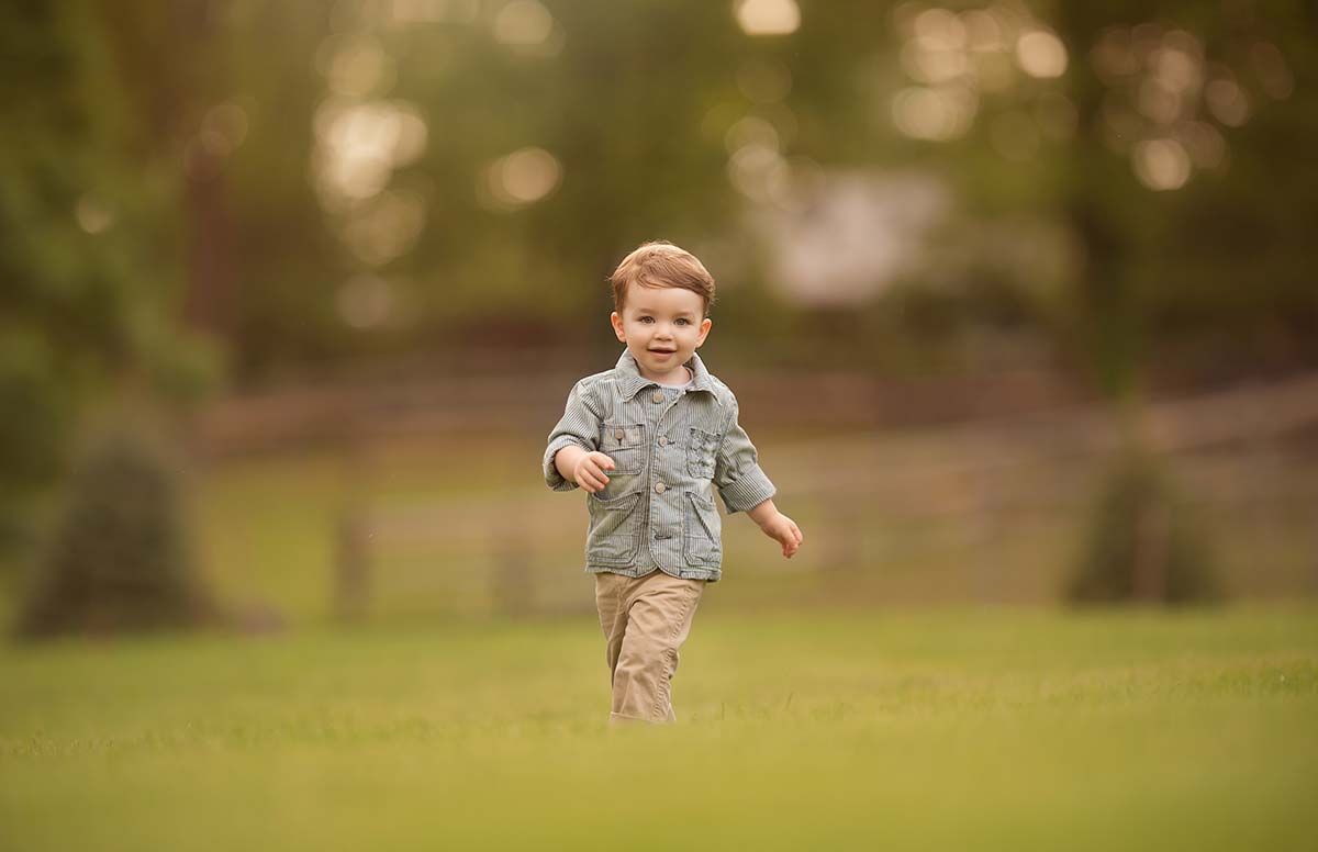 Boy on a Colorado farm running happy