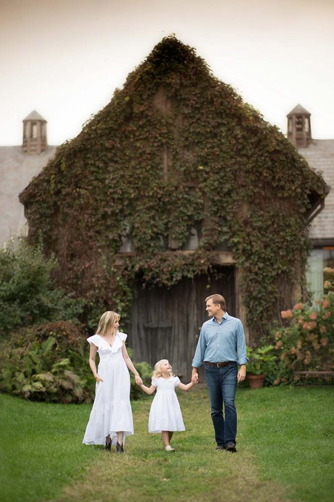 mom dad walking daughter Stone Barns family photoshoot