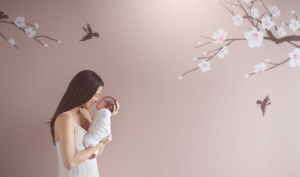 Modern baby nursery from Scarsdale NY with a Mother and her baby as captured by a newborn photographer