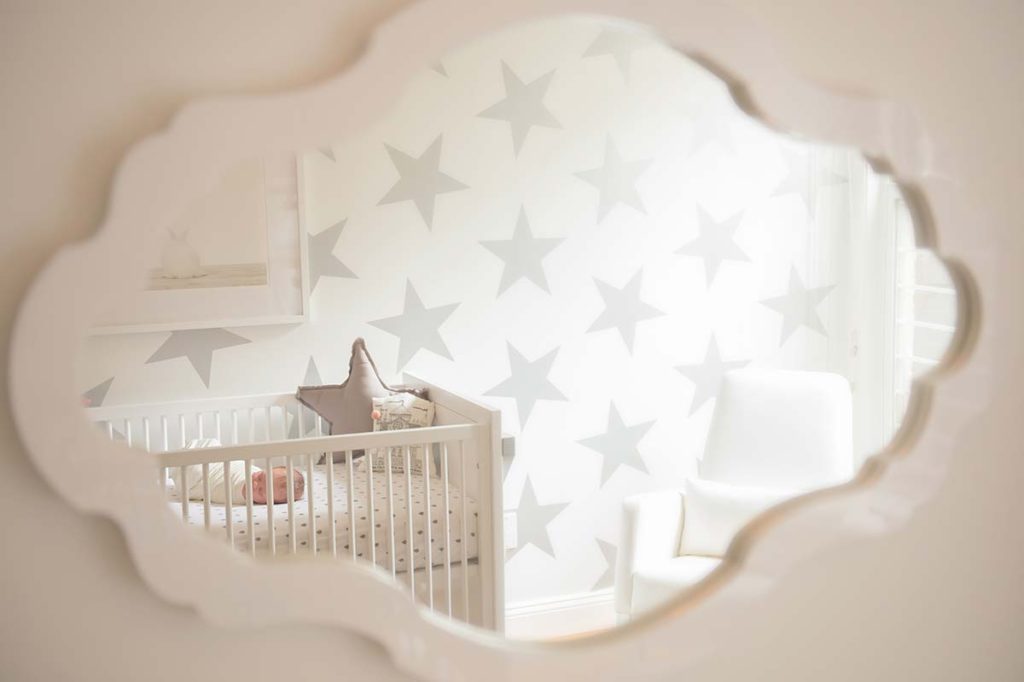 Modern day nursery with contemporary furniture and a sleeping baby
