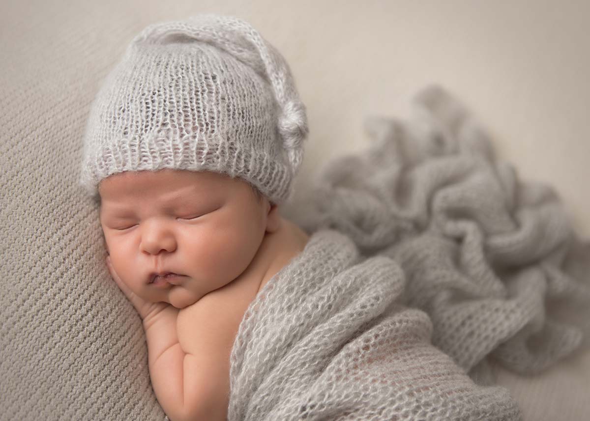 Newborn photograph with a sleeping baby taken at a Greenwich, CT photo studio